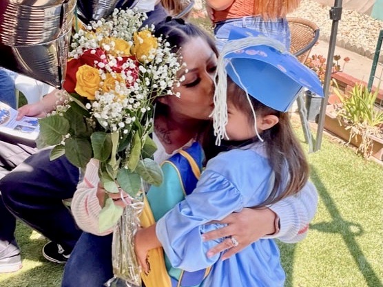mother congratulates young graduate