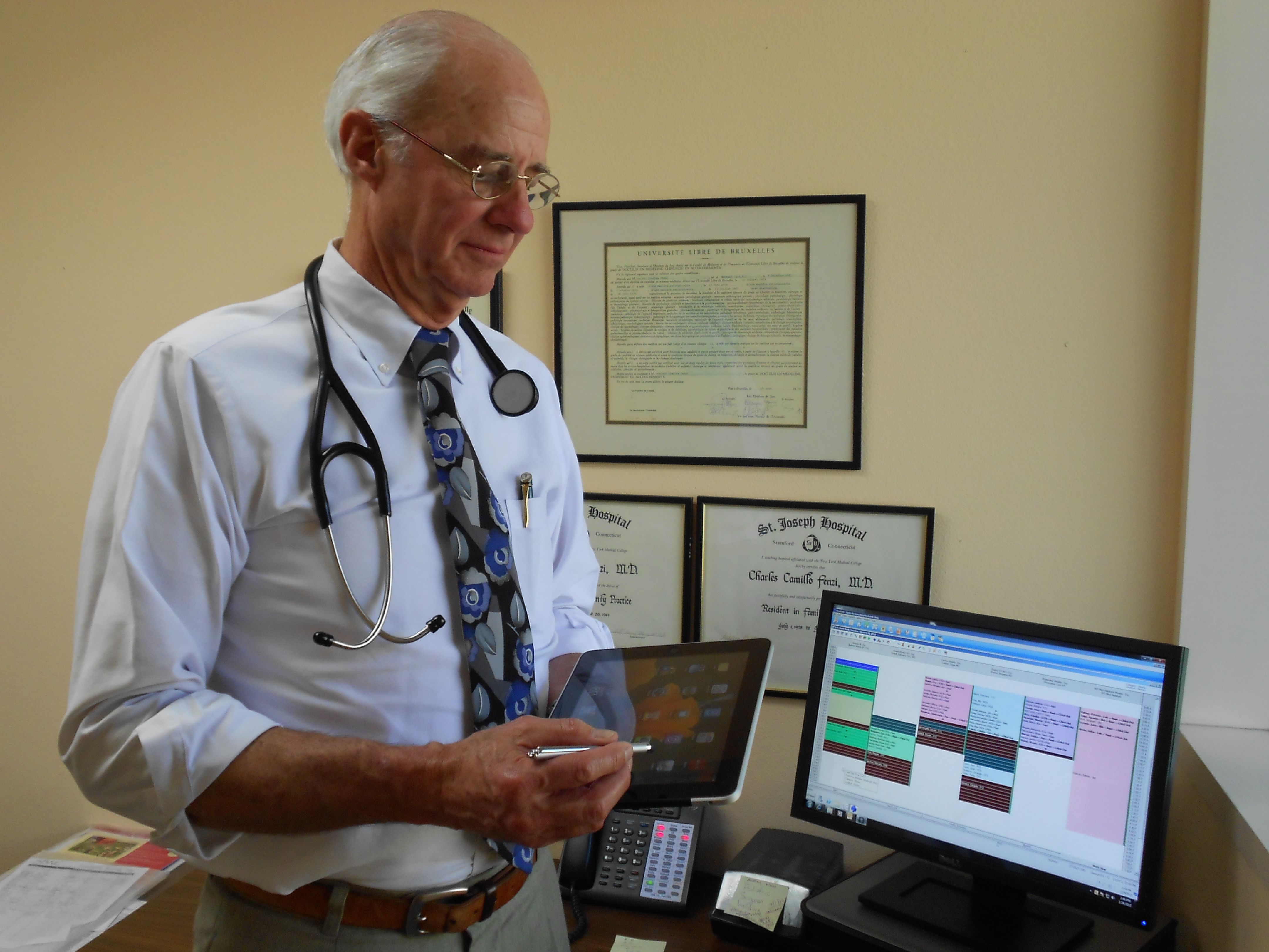 Santa Barbara Neighborhood Clinics: doctor with electronic files on computer