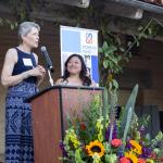 Former Chair Lynn Karlson speaking at last year's Celebration of Grants with current Chair Jaime Dufek. 