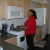 2010 Channel Islands YFS girl in red sweater in kitchenette